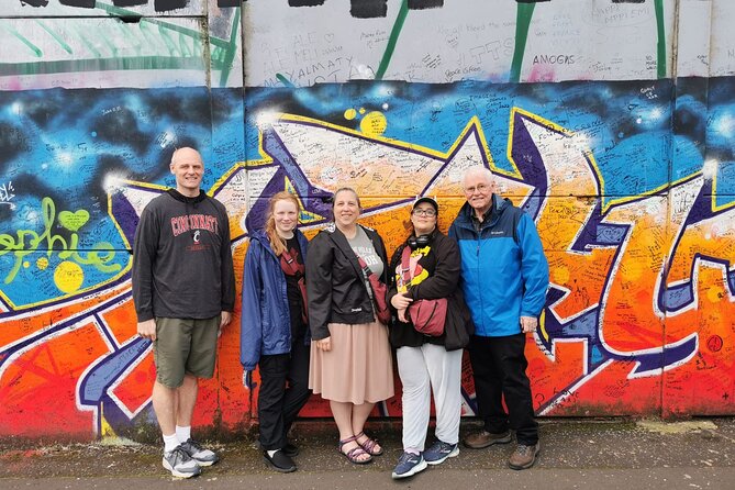Belfast's Political Mural Taxi Tour - Stop 2: International Mural Wall on Divis Street for photos and questions