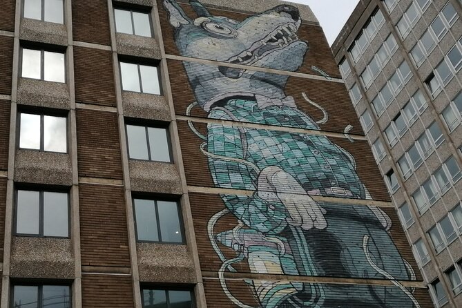 Bristol Street Art: Banksy Exploration Game and Tour - Stop 2: Aryz on a Five-Floor Building (See No Evil Energy, Fast Finish)