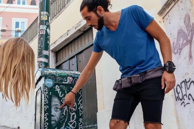 Kickstart Street Art Tour in Lisbon - Stop 1: Shepard Fairey x Vhils, then an Add Fuel piece