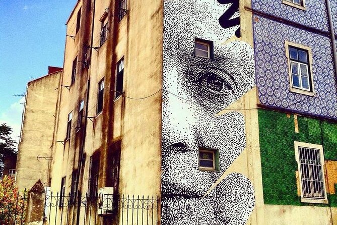 Lisbon Street Art - Private Guided Tour in a Electric Tuk Tuk - R. São Tomé 76: Bordalo II’s panda and Vhils’s Amália on the ground