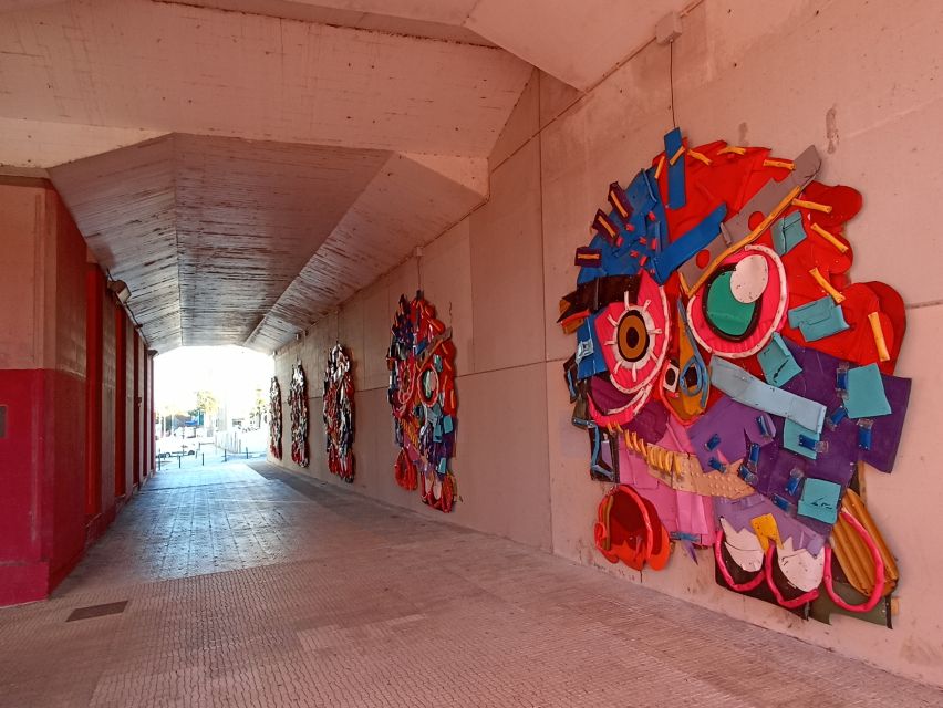 Lisbon: Street Art Tuk Tuk Tour - Art deco industrial warehouses and the working-city setting